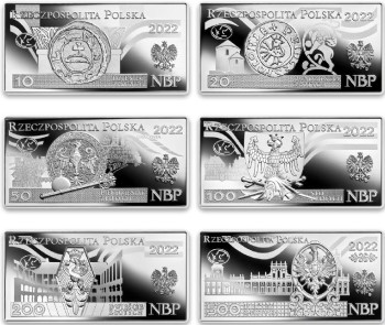 Awers srebrnych monet z polskimi banknotami obiegowymi
